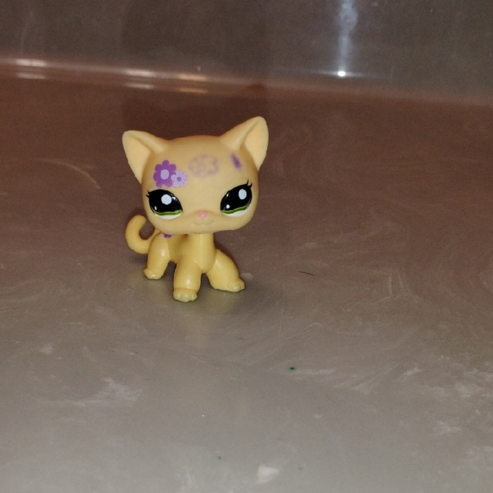 Yellow Cat Figurine with Purple Flower